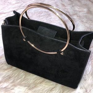 Black suede handbag